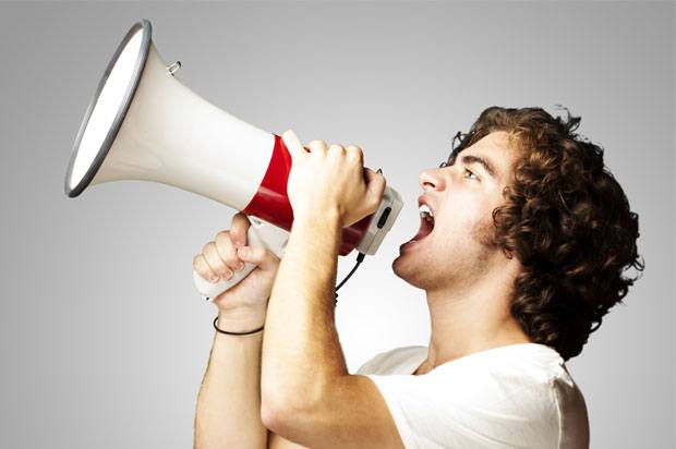 Young man with a megaphone.