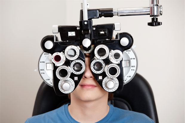 boy sitting having an eye test