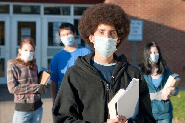 students wearing germ masks