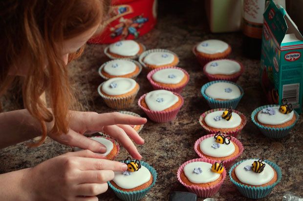 Girl decorating cupcakes