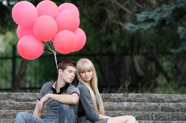 couple with red balloons