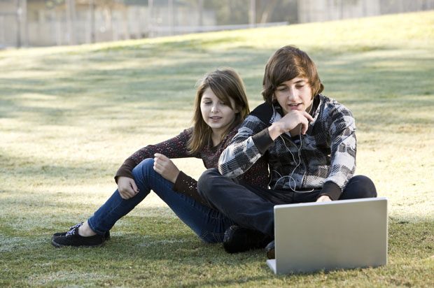 Girl and boy on a laptop