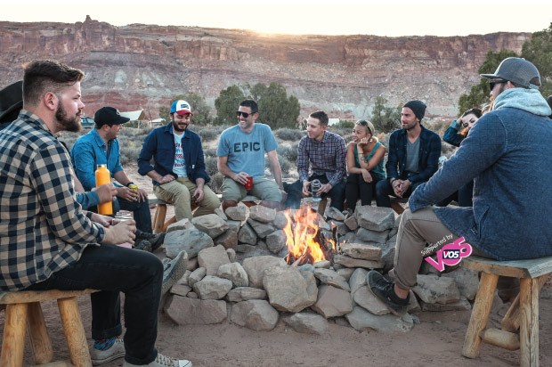Group of travelers sitting round a fire