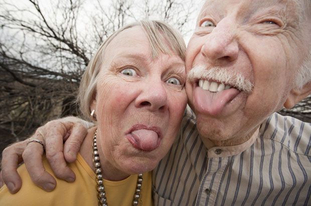 old people pulling a face