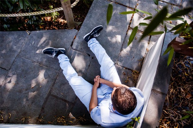 Boy sat on patio, photo taken from above
