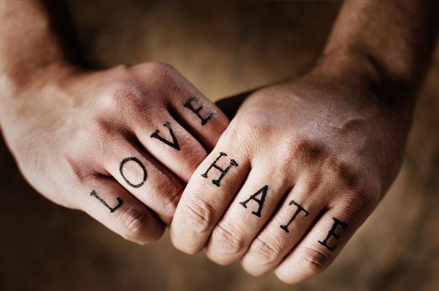 Tattoo of knuckles with the words 'love' and 'hate' tattoed onto them