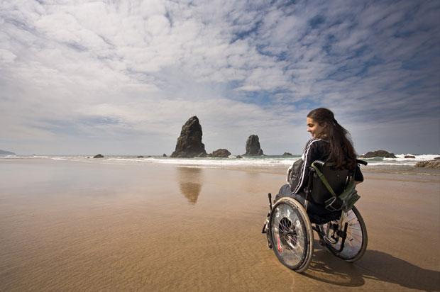 girl on beach in wheelchair