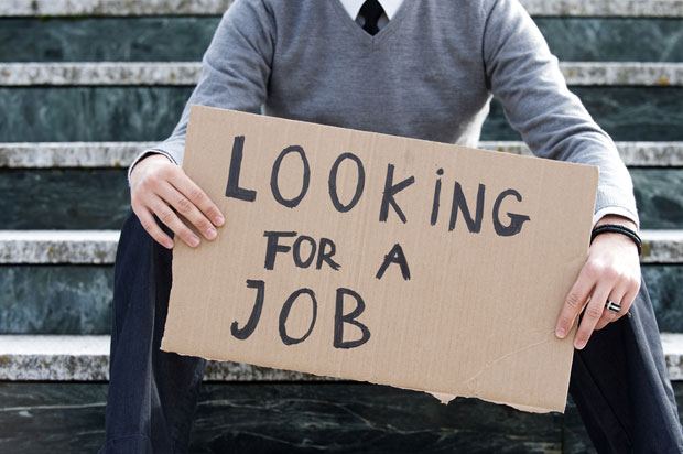 boy holding job sign