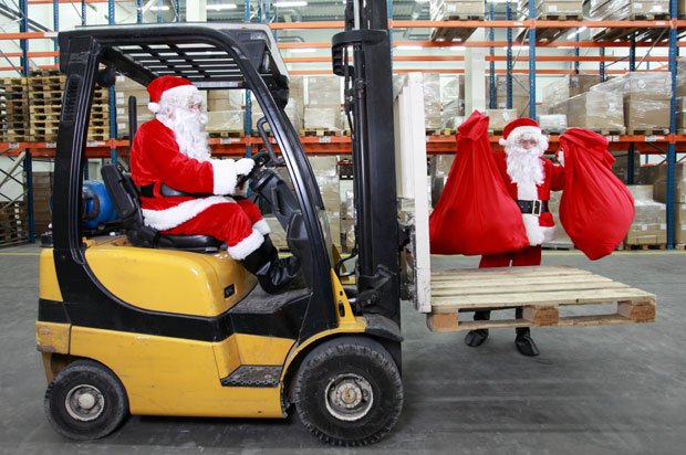 Two santas working in a factory