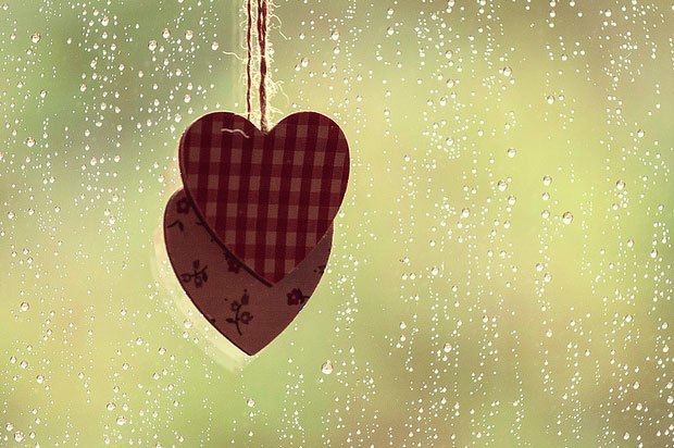 two hearts by rainy window
