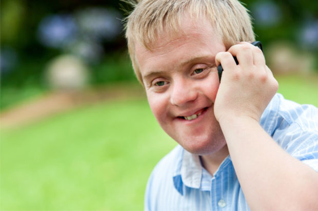 Boy with down's syndrome on the phone