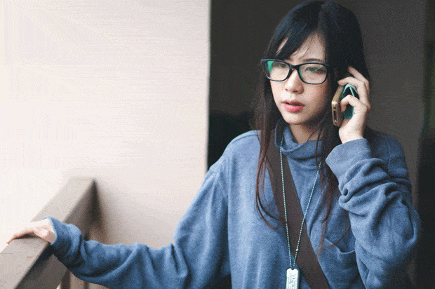 girl in glasses on the phone