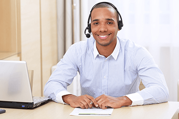 smiling guy in a call centre