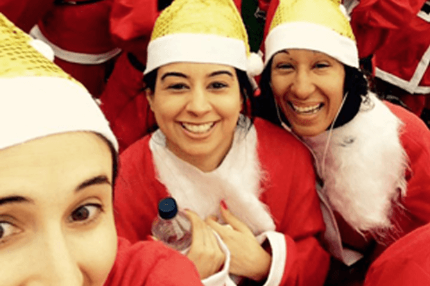 selfie of three women doing a santa run